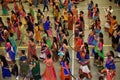 Girls, Man, women are performing garba and dandiya dance wearing traditional Indian folk dress during Navratri festival,Canada Royalty Free Stock Photo