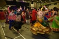 Girls, Man, women are performing garba and dandiya dance wearing traditional Indian folk dress during Navratri festival,Canada Royalty Free Stock Photo