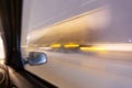 Image with motion blurred effect.Cars fast drive on the winter speedway or highway with roadway lighting in a snow storm