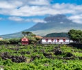 Image of mountain pico with houses and vineyard on the island of pico azores Royalty Free Stock Photo