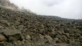 In this image is the mountain slop . many stones are lay the down of mountain. Royalty Free Stock Photo