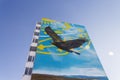 An image (mural) of a soaring golden eagle on the wall of a multi-storey building in Uralsk