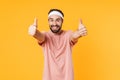 Image of muscular athletic young man smiling and gesturing thumbs up