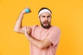 Image of muscular athletic young man having fun and lifting dumbbell Royalty Free Stock Photo