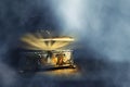 Image of mysterious magical treasure chest with light over wooden old table and dark background