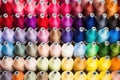 image of neatly organized thread spools by color