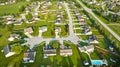 Neighborhood houses middleclass homes green lawns aerial