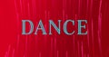 Image of neon dance text banner over neon pink light trails spinning against red background