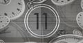 Image of number eleven in vintage black and white film projector countdown with clocks and watches