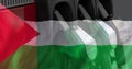 Image of oil pumps over flag of palestine