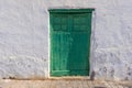 Image of an old Mediterranean green wooden door in a historic village Royalty Free Stock Photo