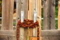 Old Rusted Chain on a Wooden Gate Royalty Free Stock Photo