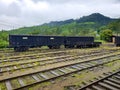 Photo of old train and wailroad cars on the old railway station at mountains of Sri Lanka Royalty Free Stock Photo