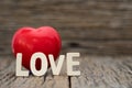 Image-One Heart and love word on wooden background. Copy space Valentines day