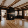 Open concept living room with fireplace wooden beams black door frames and autumn colors Royalty Free Stock Photo