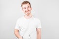 Image of optimistic positive young unshaved man in hat isolated over white wall background