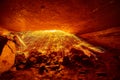 Orange steel wool sparks illuminating cave exit Royalty Free Stock Photo