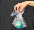 Our blue planet trapped in plastic waste stock photo