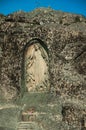 Image of Our Lady of the Good Star carved in a rocky cliff