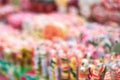 Image out of focus, tasty colorful lollipops different shapes on the counter fair