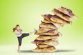Overweight woman kicking a pile of pizzas Royalty Free Stock Photo