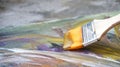 Image of paint brush on abstract painting