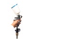 Image of the painter`s arm hand holding industrial size spray gun used for industrial painting and coating and isolated on white Royalty Free Stock Photo