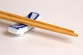 Chinese bamboo chopsticks on ceramic support
