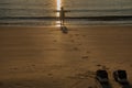 a pair of sneaker left at the beach