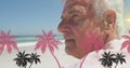 Image of palm trees over caucasian senior men on the beach Royalty Free Stock Photo