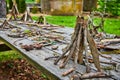 Park background of picnic table covered in small stick teepee piles Royalty Free Stock Photo