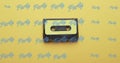 Image of party texts over tape on yellow background