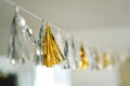 Image of Party tinsel garland draperi on the rope in silver and gold metallic colour