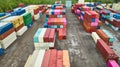 Pastel colored shipping containers aerial, rows of colorful semi truck trailers in shipping yard Royalty Free Stock Photo