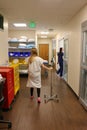 Image of patient walking in hospital hallway Royalty Free Stock Photo