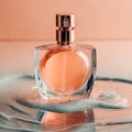 Image in peach fuzz tones of perfume bottle in water on peach color background. Perfume advertisement Royalty Free Stock Photo