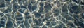 Pebble water caustics background with color refractions