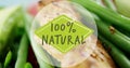 Image of 100 percent natural text over fresh vegetables Royalty Free Stock Photo