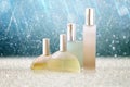 Image of perfume bottles isolated on glitter shiny background