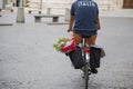 Image of person cycling with luggage in the historic center