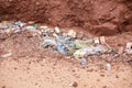 a pile of various plastic bottles and a pile of rocks Royalty Free Stock Photo