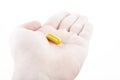 Image of pill hand white background