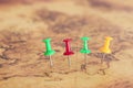 Image of pins attached to map, showing location or travel destination. selective focus. Royalty Free Stock Photo