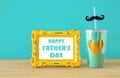 Image of plastic cup with golden heart. Father`s day concept. Royalty Free Stock Photo