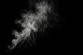 Ethereal wisps of smoke swirling against a deep black background, creating an otherworldly visual effect at night Royalty Free Stock Photo