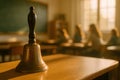 Vintage school bell on desk. traditional classroom signaling and educational nostalgia Royalty Free Stock Photo
