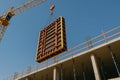 Construction Crane Lifting Wall Frame. Building Site Work Royalty Free Stock Photo