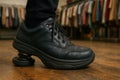Black Leather Sneakers with Spring Sole. Innovative Comfort Footwear Royalty Free Stock Photo