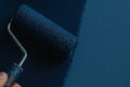 Paint Roller Coating Wall With Blue Paint For Renovation And Interior Design Royalty Free Stock Photo