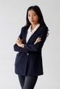 The image portrait. Happy beautiful Asian woman in a businesswoman suit, black suit In the studio with a white background